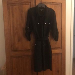 Black dress with button and zipper. With belt